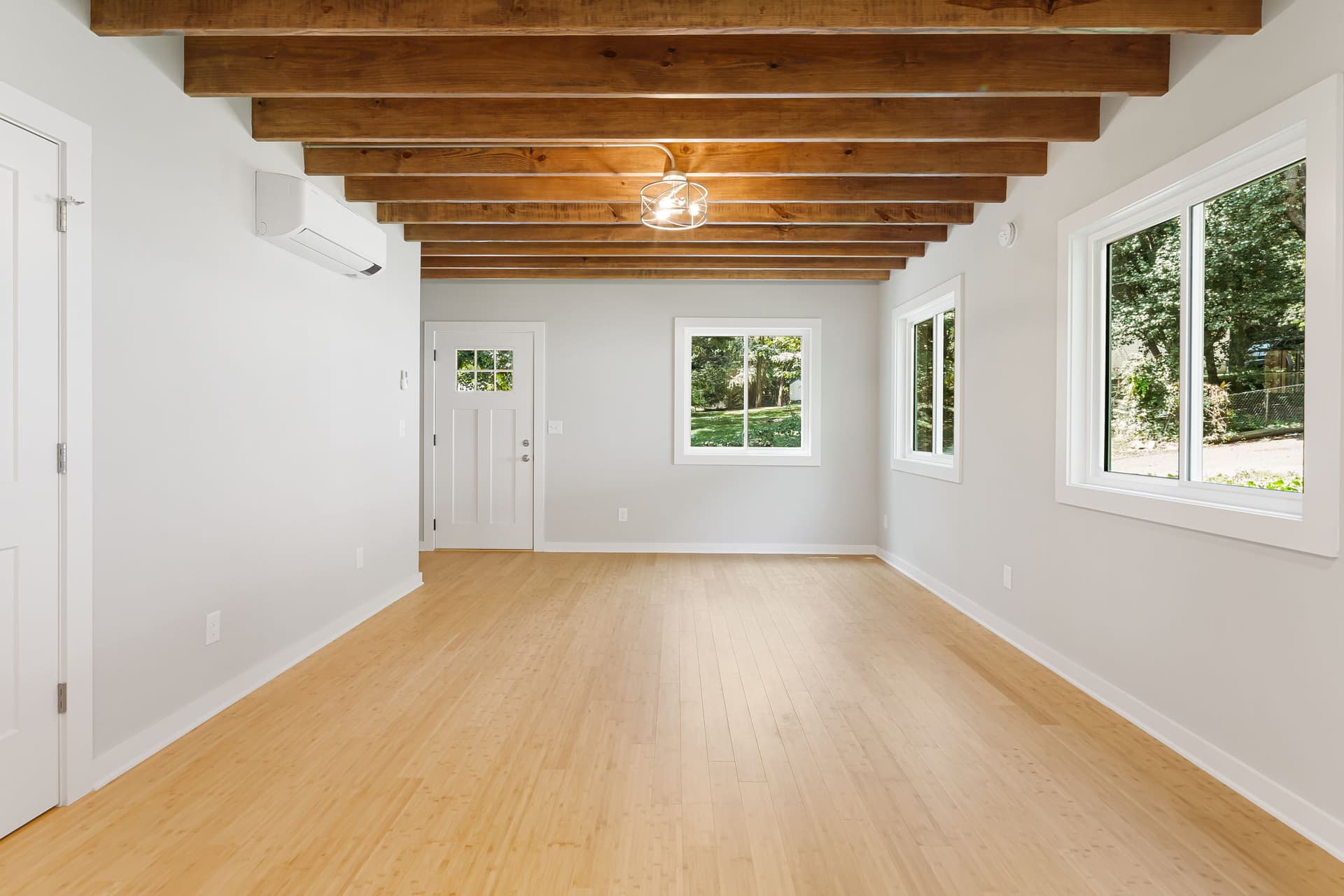 Compact Cottages interior with exposed beam ceiling