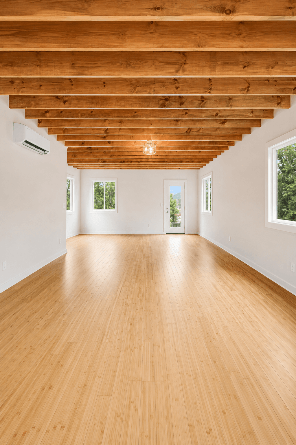 Master on Main 3 Bed, living/dining area with exposed wood beam ceiling and bamboo floors